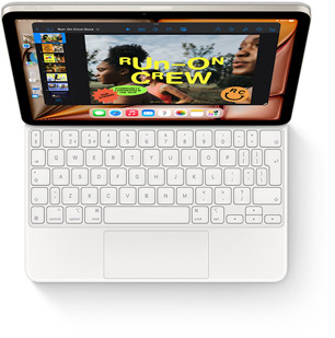 Top-down view of iPad Air with Magic Keyboard in white.
