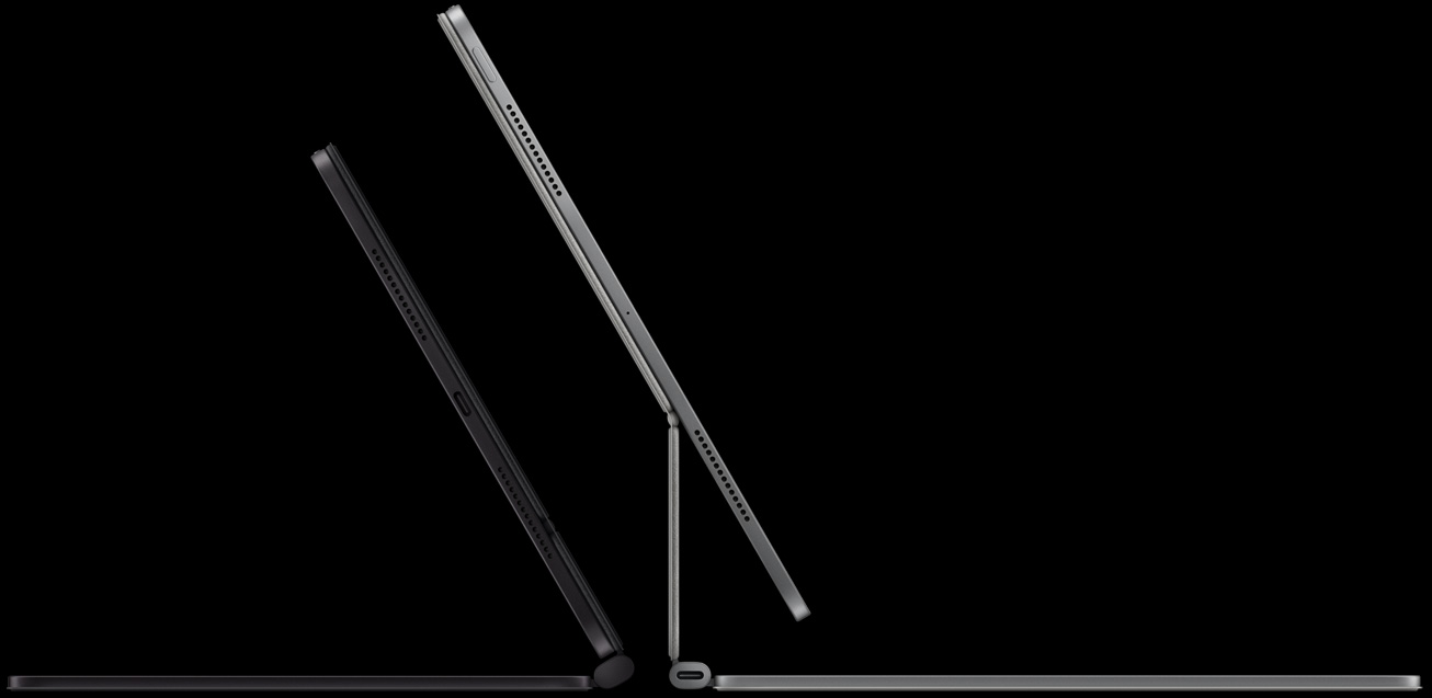 Vista lateral de dois modelos do iPad Pro com Magic Keyboard colocados na horizontal a mostrar o suporte articulado suspenso