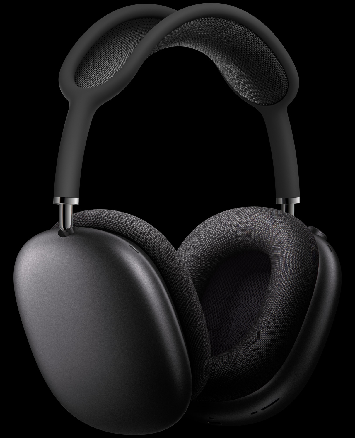 AirPods Max in Space Grey at three-quarter perspective, with external microphones relieved into ear cups.