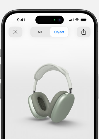 Obraz przedstawia zielone słuchawki AirPods Max w rzeczywistości rozszerzonej na ekranie iPhone’a.