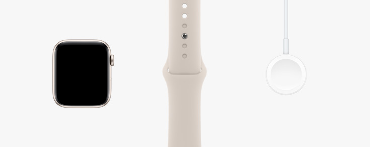 Usporiadané v rade: pohľad spredu na hardvér hodiniek Apple Watch SE, športový remienok vo hviezdnej bielej a magnetický nabíjací kábel USB-C.
