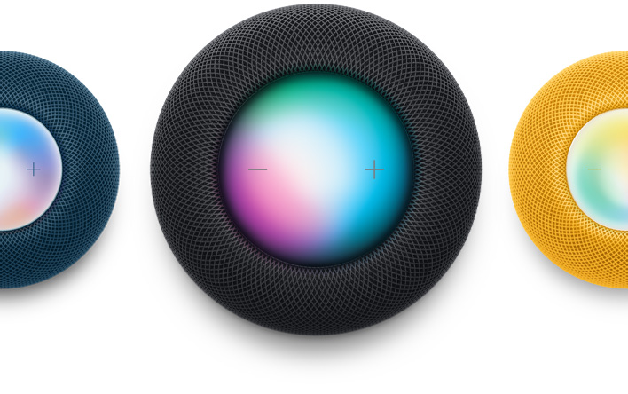 Se muestran un HomePod mini azul, un HomePod color medianoche y un HomePod mini amarillo desde arriba. Siri está activado.