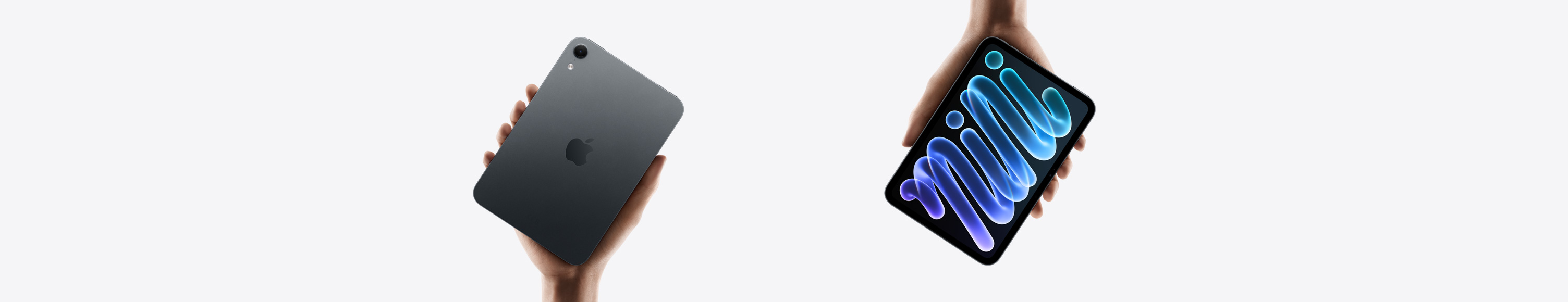 iPad mini, black, held in hand