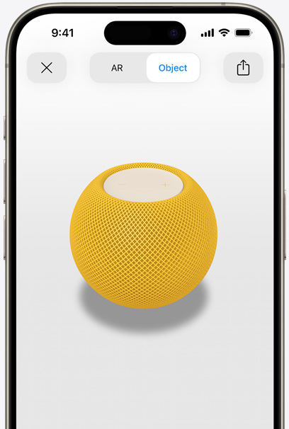 En HomePod i farven gul vises i AR på en iPhone-skærm.