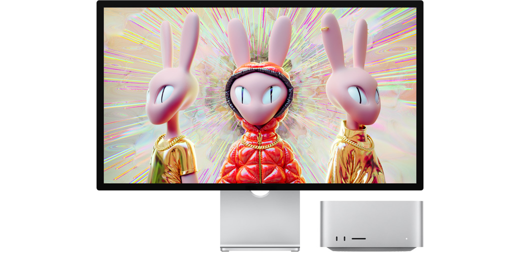 „Mac Studio“ kartu su „Studio Display“, kuriuose rodomas į kiškius panašių robotų 3D vaizdas.