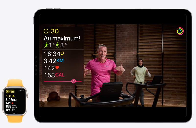 Un entraînement Apple Fitness+ affiché sur un iPad Pro, et les données de cet entraînement affichées sur une Apple Watch Series 9 placée à côté.