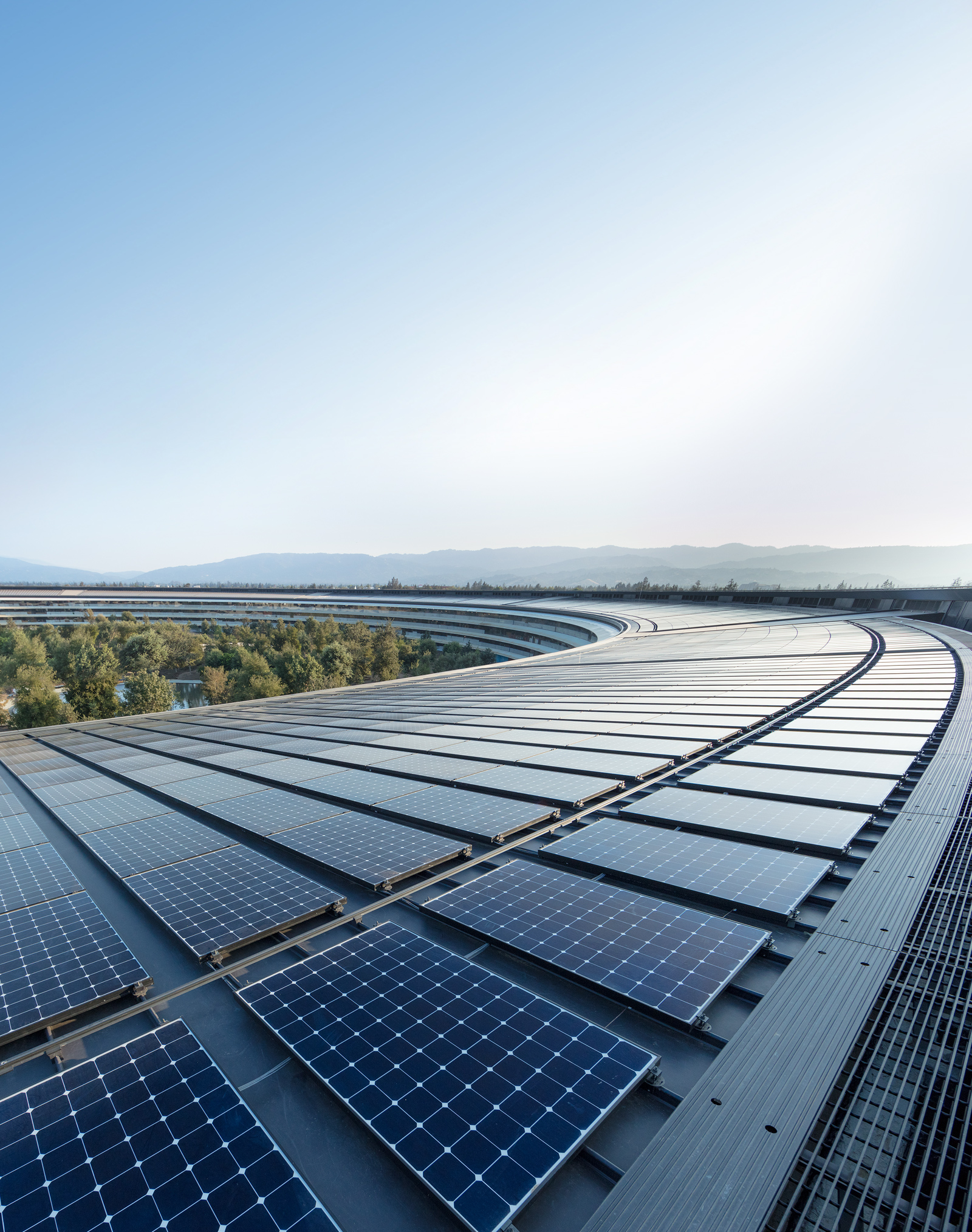 The rooftop solar installation at Apple Park helps power the building with 100 percent renewable energy.