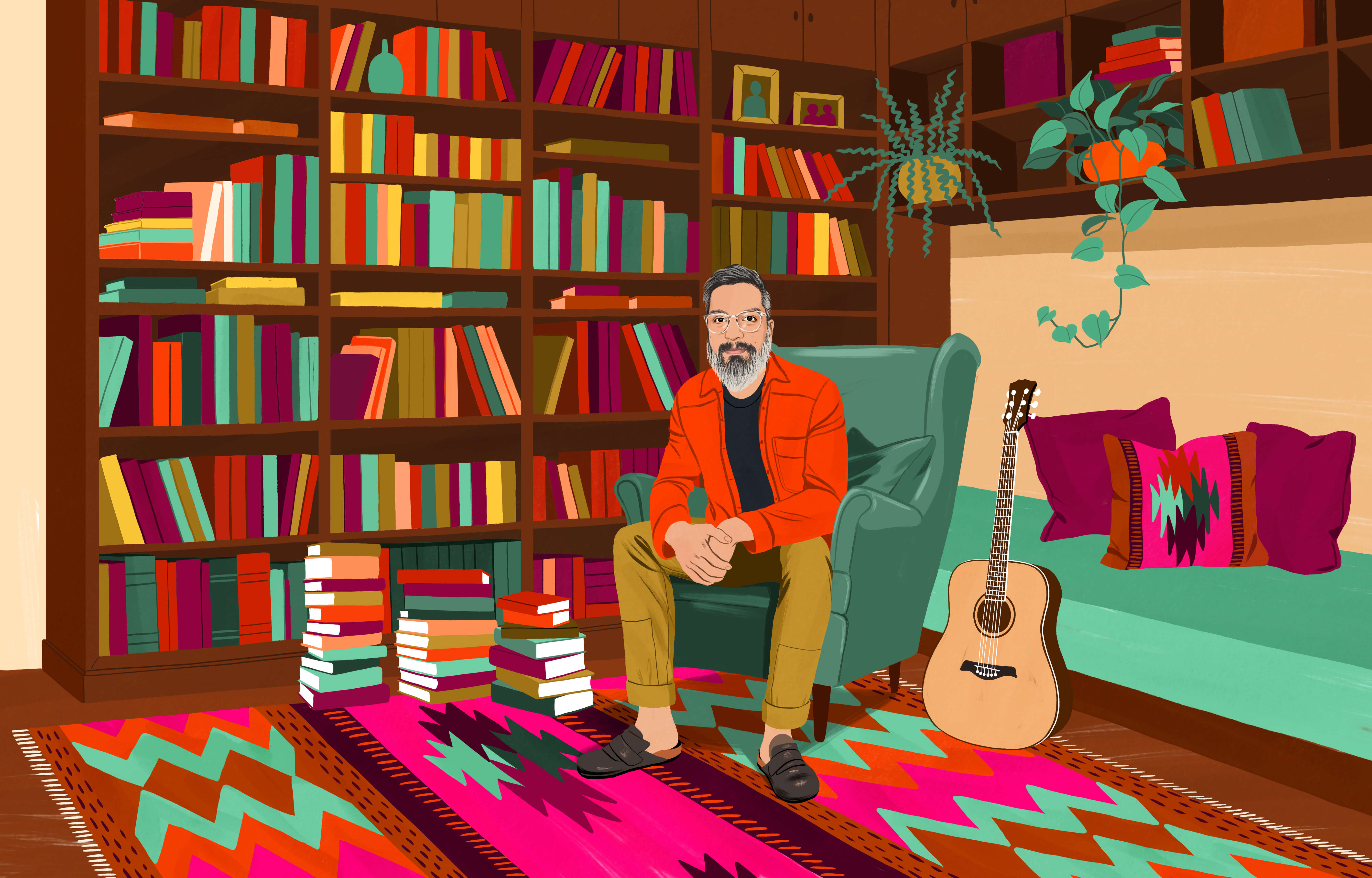 JP 坐在高背扶手椅上，旁边的书架上放满了书，地上也有堆得高高的几摞书。地上铺着彩色花纹的智利传统风格地毯。距离他一臂远的地方立着一把原声吉他。