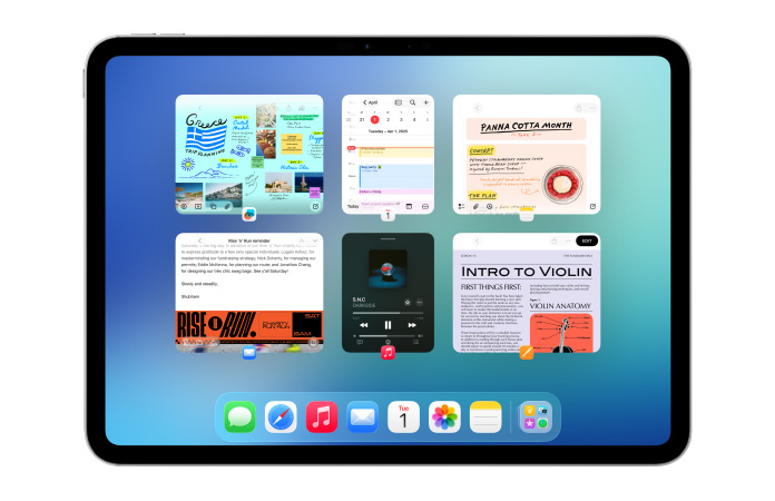 Ein iPad im Querformat, das Display zeigt mehrere Apps wie Kalender und Music in sechs Fenstern, die in zwei Reihen aufgereiht sind, um alle Fenster gleichmässig anzuzeigen