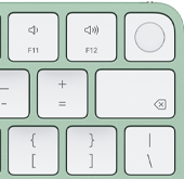 Magic Keyboard, top-right corner, green color, Touch ID , delete key, and volume function keys