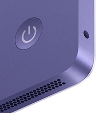 iMac, rear exterior, purple color, features: power button, headphone jack, and speaker grille