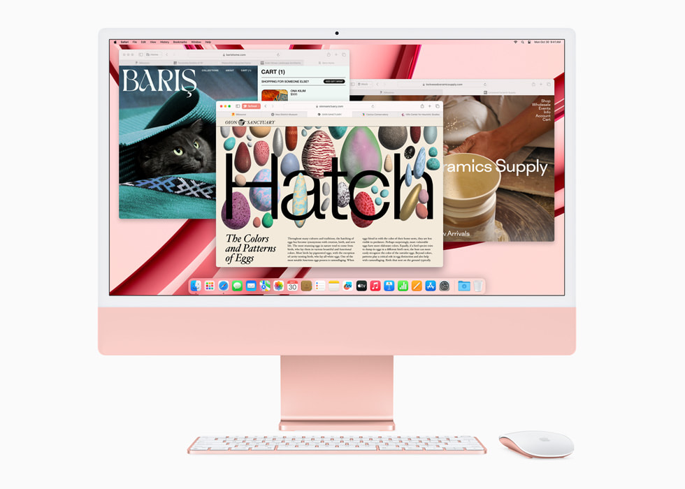 Hình ảnh Safari hiển thị trên iMac mới với M3 màu hồng cùng với bàn phím và chuột cùng tông màu.