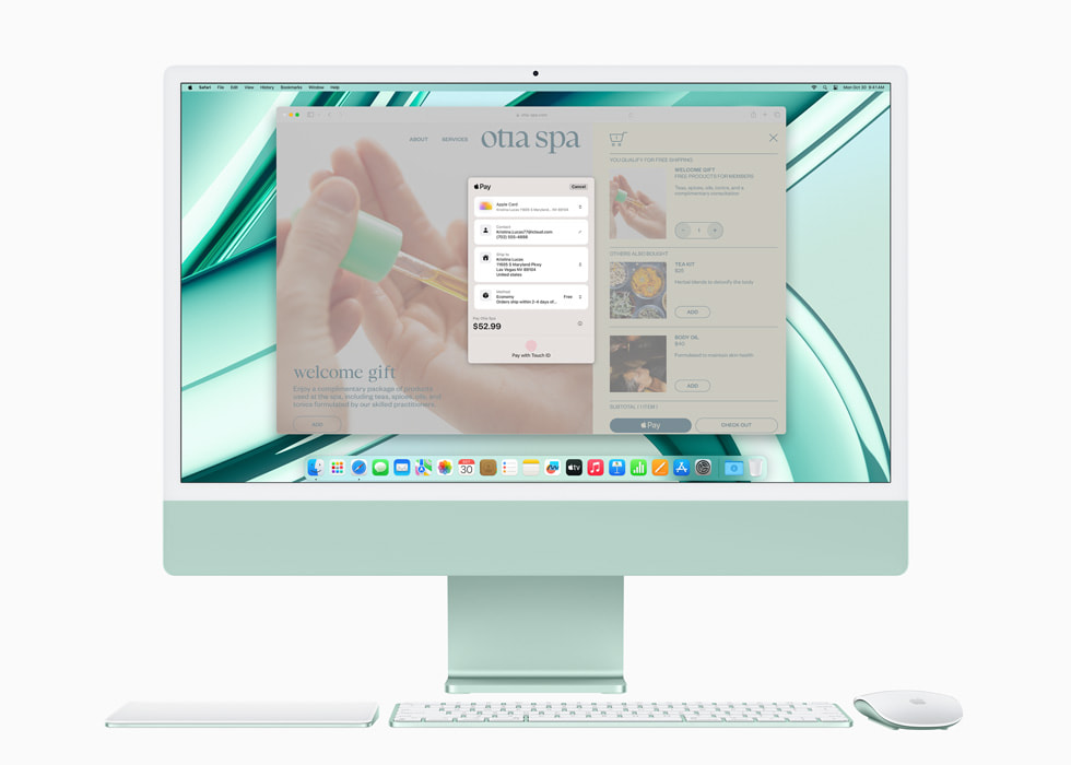 Hình ảnh Apple Pay trên iMac mới với M3 màu xanh lá cùng với bàn di chuột, bàn phím và chuột cùng tông màu.