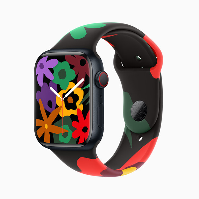 Un Apple Watch Series 9 con la correa y la esfera de la nueva colección Black Unity. En esta imagen, la esfera muestra una variedad de flores de distintos colores.