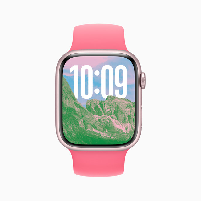 A Photos watch face on Apple Watch Series 9 shows tall mountains.