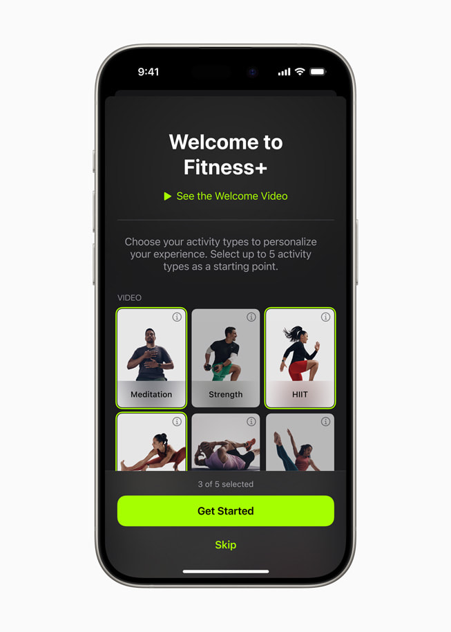 The welcome screen from the redesigned Apple Fitness+ experience is shown on iPhone 15 Pro.