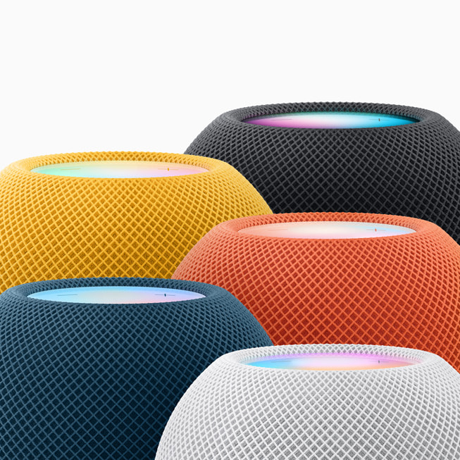 An up-close look at the full lineup of HomePod mini colors: midnight, yellow, orange, blue, and white.
