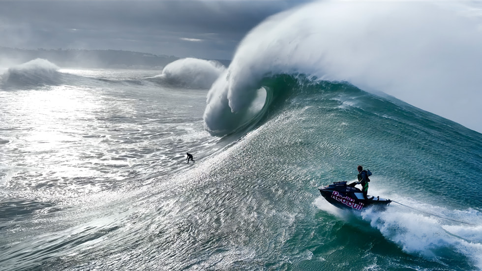 A still from the upcoming extreme sports series shows a big-wave surfer.