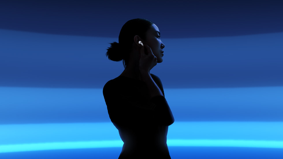 A silhouette of a user with AirPods 4 is shown against a blue background.