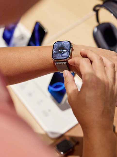 A customer tries on the new Apple Watch Series 10.