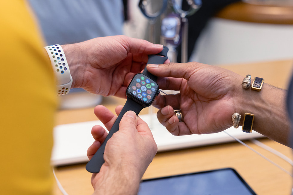 Two customers hold the new Apple Watch series 10 at Apple Regent Street in London.