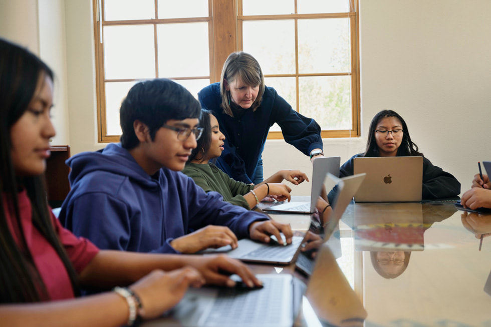 A group of students at the Santa Fe Indian School in Santa Fe, New Mexico, learn from an instructor.