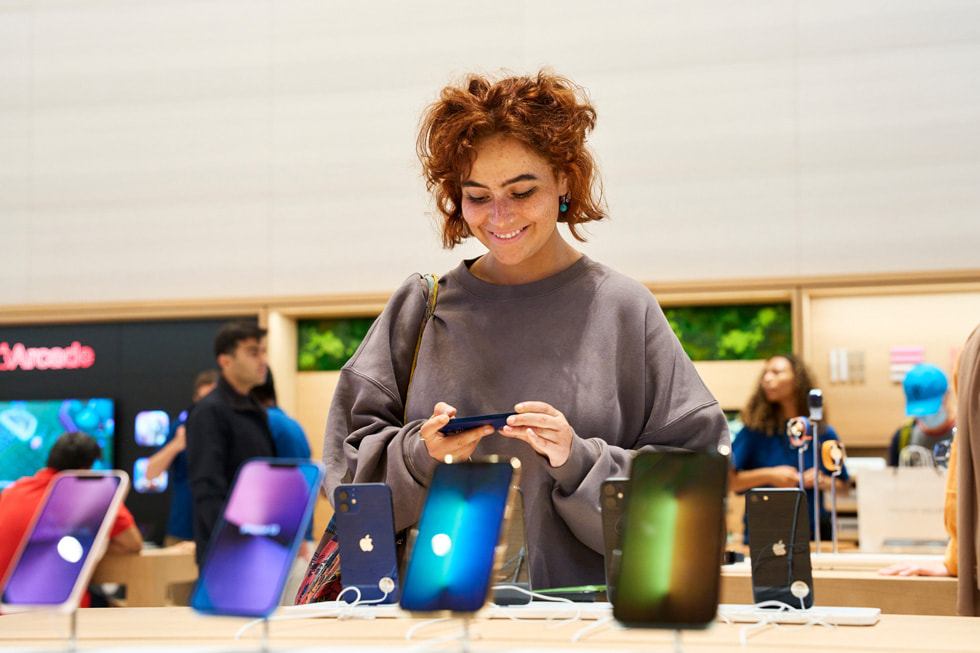 A customer takes a look at the iPhone lineup at Apple Brompton Road.