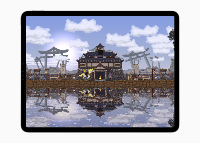 Một ảnh tĩnh từ trò chơi Kingdom Two Crowns hiển thị một ngôi nhà bên cạnh một vùng nước trên iPad Pro.