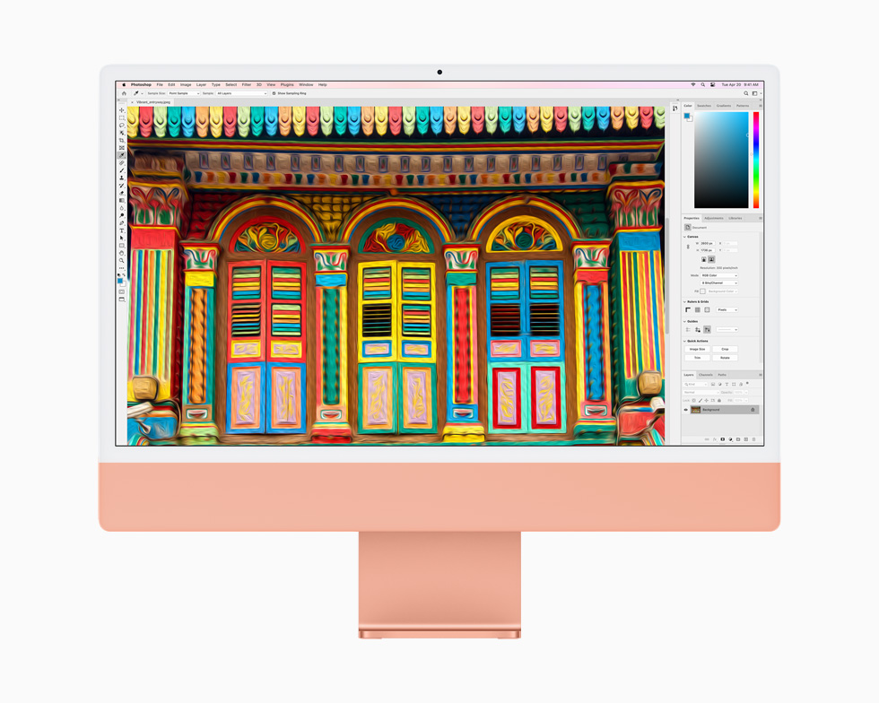 Et bilde redigeres i Photoshop på en oransje iMac.