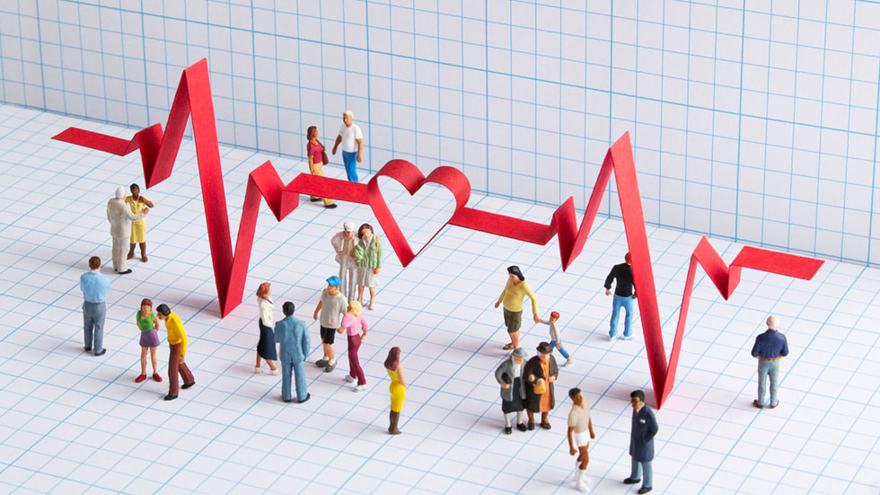 Overhead illustration of people surrounded by a large ECG signal graphic. 