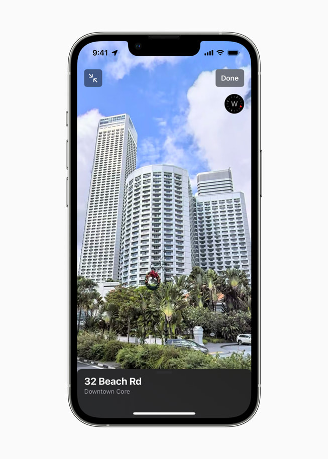 An iPhone screen shows 32 Beach Road in Singapore on Apple Maps.