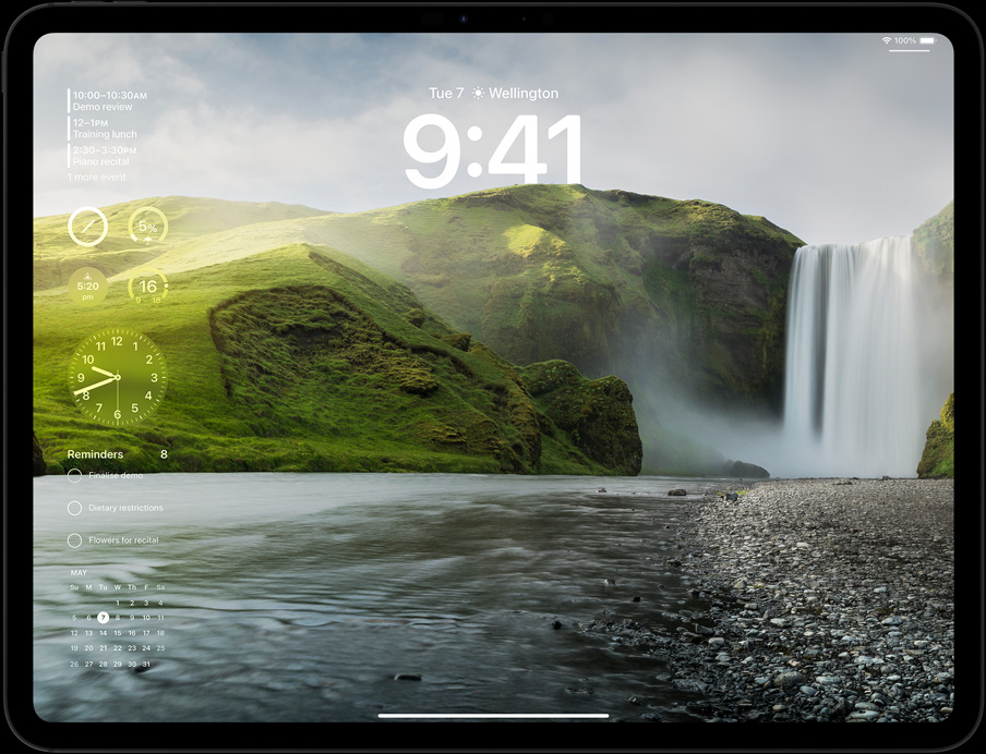 iPad Pro in landscape orientation, screen displaying user’s lock screen