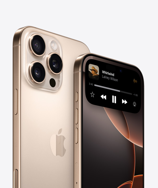 Back of iPhone 16 Pro in White Titanium showing three camera lenses behind another iPhone Pro highlighting Dynamic Island on display screen.