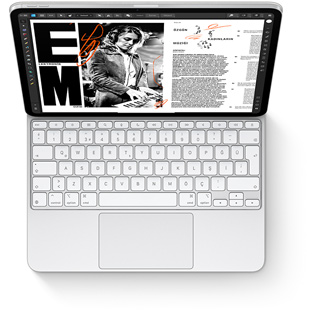 iPad Pro ile iPad Pro için beyaz renkte Magic Keyboard’un tepeden görünümü.