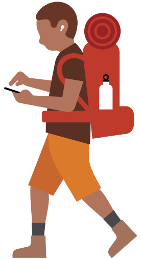 Person with hiking backpack wearing hearing aid and looking down at an iPhone in their hand