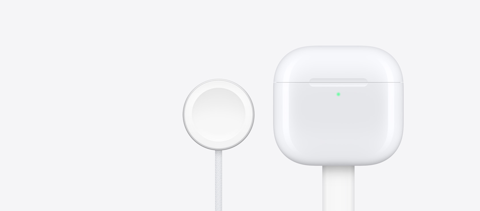 The AirPods 4 charging case alongside an Apple Watch charger.