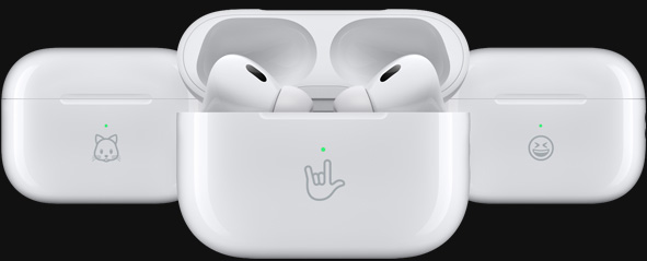 Three MagSafe Charging Cases are engraved with example emoji: a kitten, an I‑love‑you hand sign and a smiley face.