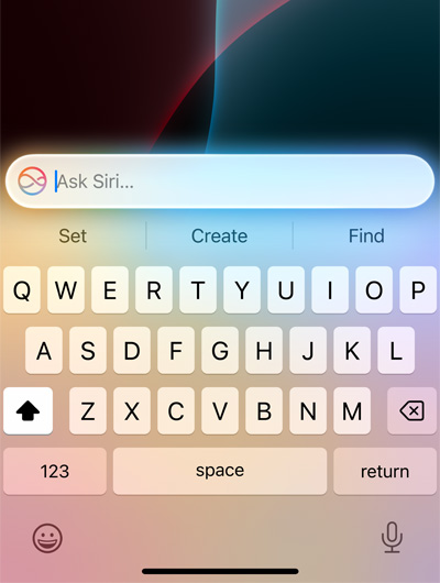 A text field at the top of keyboard in iPhone says Ask Siri