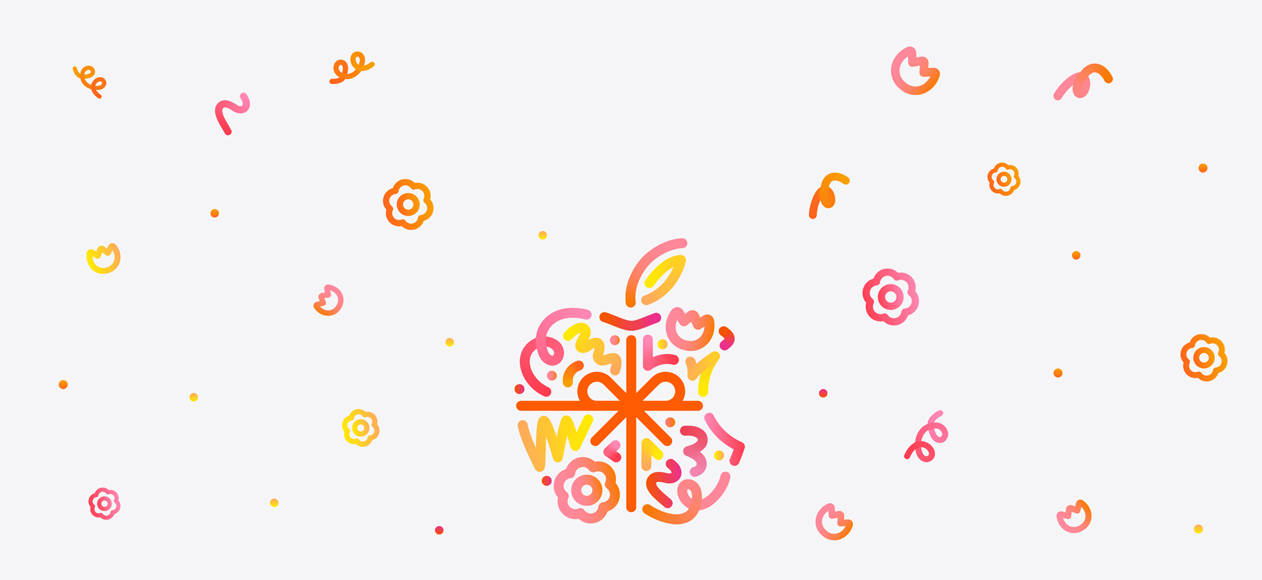 Dots, squiggles, spirals, and flower shapes in different hues of orange, pink, and yellow burst and spread across from behind Apple logo, wrapped in an orange color bow, made up of dots, squiggles, spirals, and flower shapes in different hues of orange, pink, and yellow