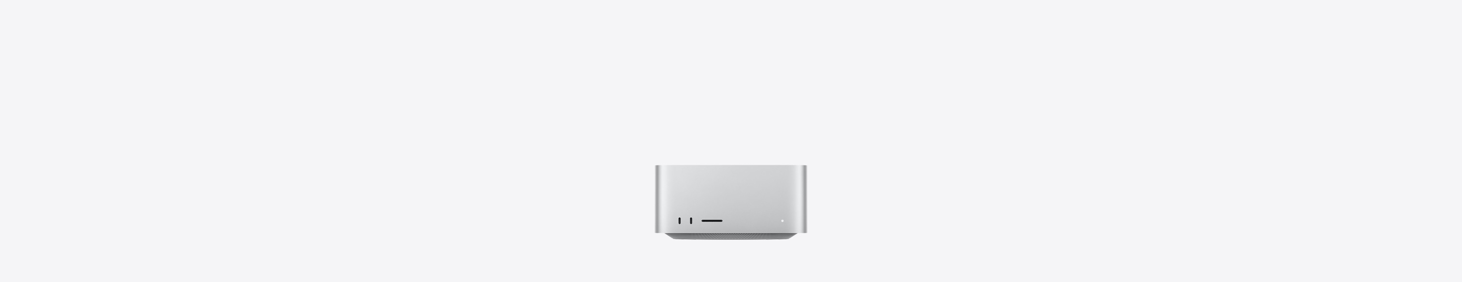 Parte frontal de un Mac Studio color plata, dos puertos USB-C, ranura para tarjeta SDXC, luz indicadora de estado, base cónica en la parte inferior, superficie plana en la parte superior, lados redondeados y bordes rectos