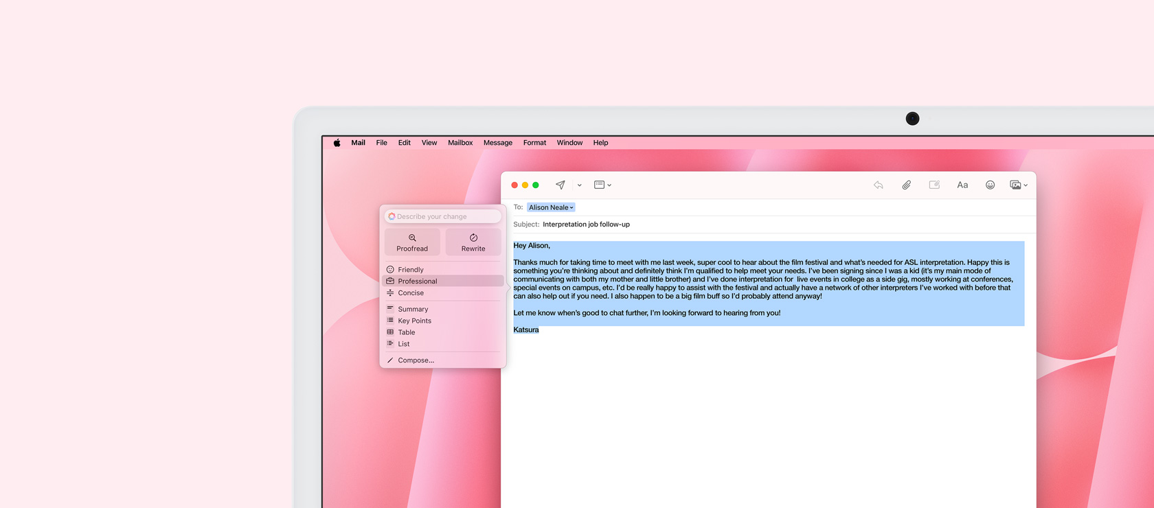 iMac screen displaying Mail app with Writing Tools feature. An email draft is highlighted, and the ‘Professional Tone’ option is shown next to it