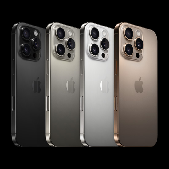 Back view of iPhone 16 Pro, all four finishes, Black Titanium, White Titanium, Natural Titanium, and Desert Titanium.