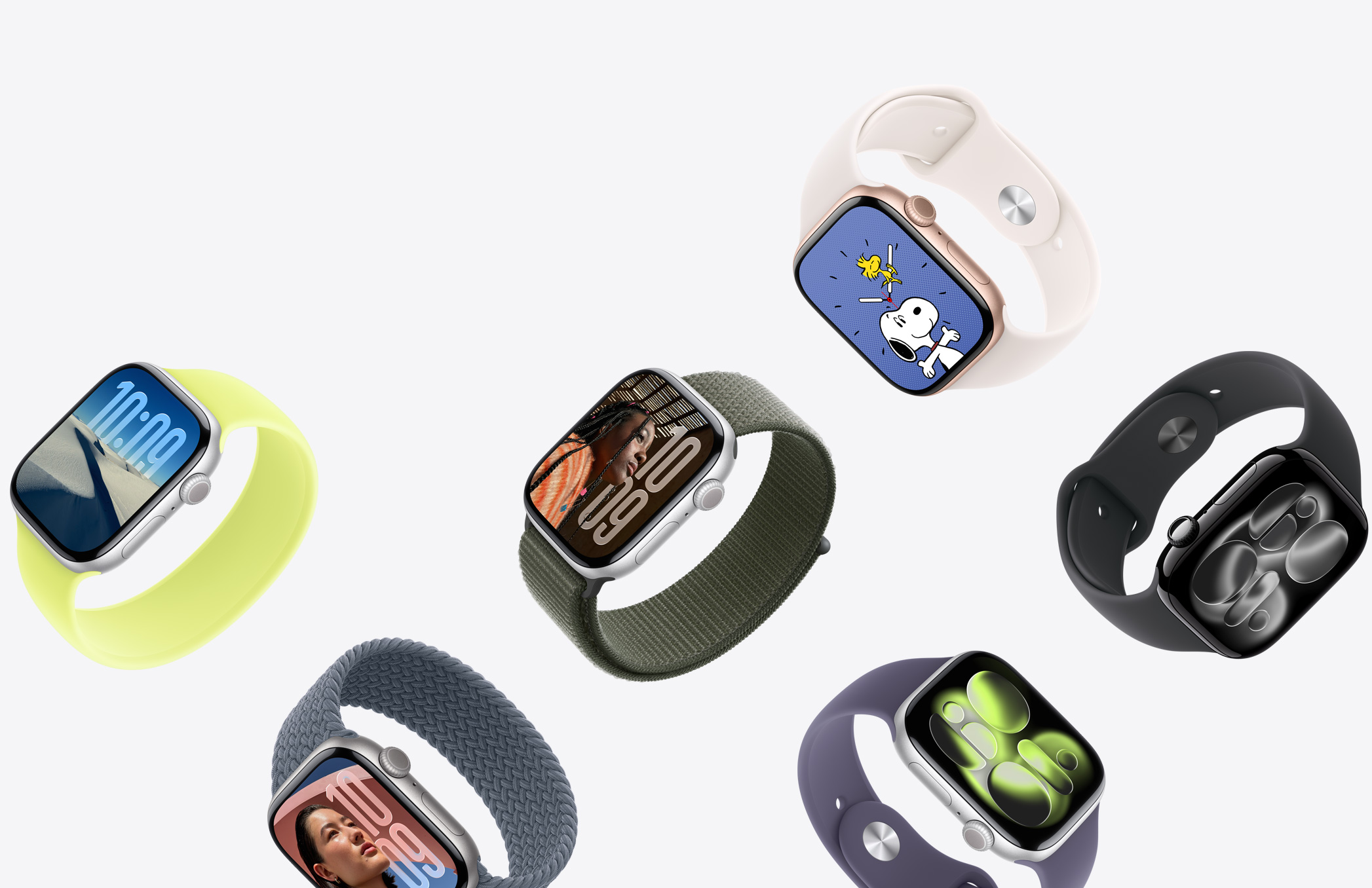 Eine Auswahl an Apple Watch Geräten in unterschiedlichen Gehäusefarben mit vielen verschiedenen Armbandfarben und -materialien.