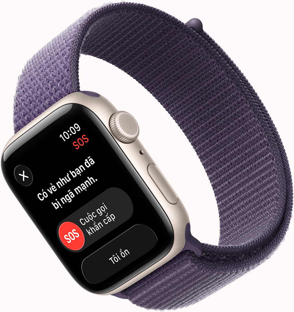 Apple Watch SE 3, vỏ nhôm, màu ánh sao, thông báo Phát Hiện Ngã SOS, các nút cuộc gọi khẩn cấp, mặt ngoài bên phải, Digital Crown, micrô, nút sườn, dây đeo, Dây Quấn Thể Thao, màu tím sương khói